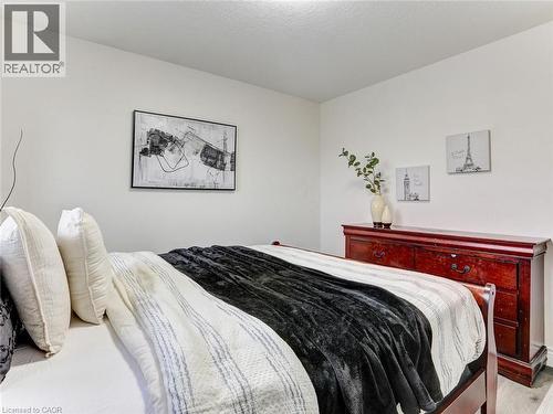 Neutral white walls provide a versatile backdrop - 154 Deerpath Drive, Guelph, ON - Indoor Photo Showing Bedroom