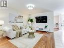 Living area featuring wood-finish flooring, white walls, and a recessed ceiling light - 154 Deerpath Drive, Guelph, ON  - Indoor Photo Showing Living Room 