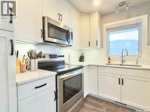 254 Brighton Gate, Saskatoon, SK - Indoor Photo Showing Kitchen With Double Sink