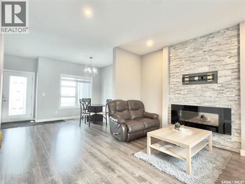 254 Brighton Gate, Saskatoon, SK - Indoor Photo Showing Living Room With Fireplace