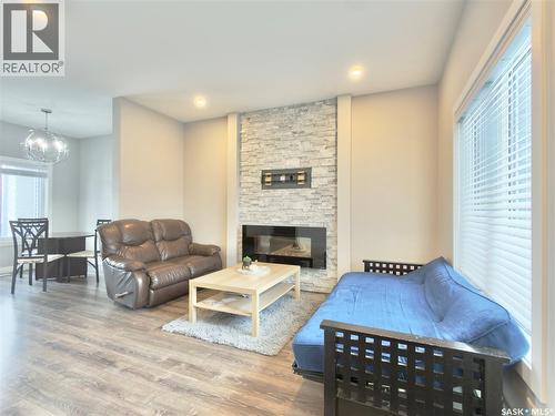 254 Brighton Gate, Saskatoon, SK - Indoor Photo Showing Living Room With Fireplace