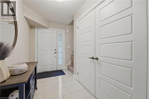 Entryway featuring white tile flooring and neutral wall tones - 7 Gibson Place Unit# 26, St. Catharines, ON - Indoor Photo Showing Other Room