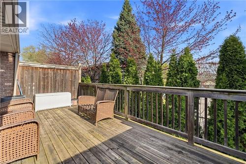 Wood-finish deck with a natural wood railing - 7 Gibson Place Unit# 26, St. Catharines, ON - Outdoor With Deck Patio Veranda