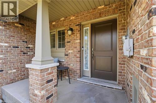 Brick facade with an inviting covered porch - 7 Gibson Place Unit# 26, St. Catharines, ON - Outdoor With Exterior