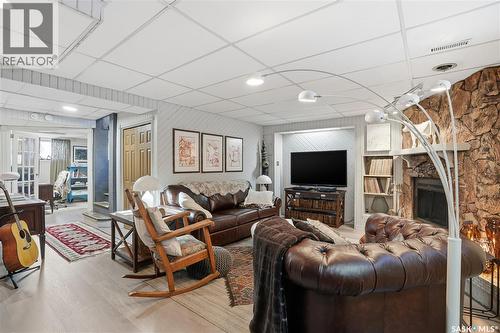 19 Tate Street, Regina, SK - Indoor Photo Showing Living Room With Fireplace