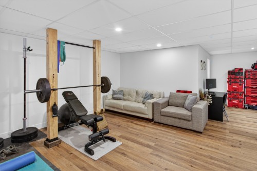 Salle familiale - 74 Rue Grandmaison, Mont-Blanc, QC - Indoor Photo Showing Gym Room