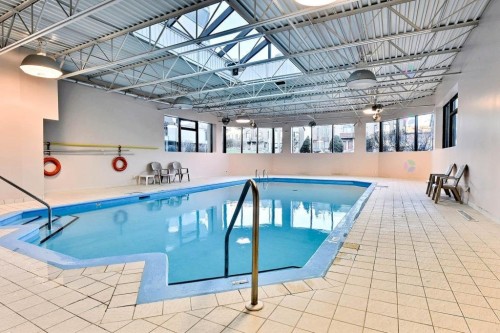 Pool - 102-999 Rue White, Montréal (Saint-Laurent), QC - Indoor Photo Showing Other Room With In Ground Pool