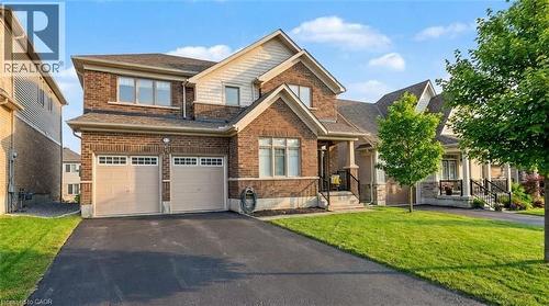 Brick exterior with light siding accents and a contrasting roofline - 123 Rea Drive, Fergus, ON - Outdoor With Facade