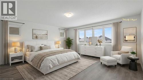 Spacious bedroom featuring wood-finish flooring, a contemporary ceiling light fixture, and large windows with mountain scenery - 123 Rea Drive, Fergus, ON - Indoor Photo Showing Bedroom
