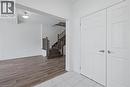 Entryway featuring white six-panel doors with chrome hardware, white floor tile, and a chandelier - 123 Rea Drive, Fergus, ON  - Indoor Photo Showing Other Room 