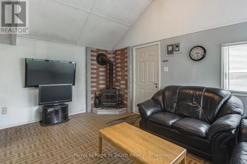 35 Tiny Beaches Road S, Tiny, ON - Indoor Photo Showing Living Room With Fireplace