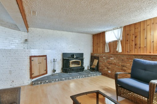 Salle familiale - 532 6E Avenue, Saint-Jérôme, QC - Indoor Photo Showing Living Room With Fireplace