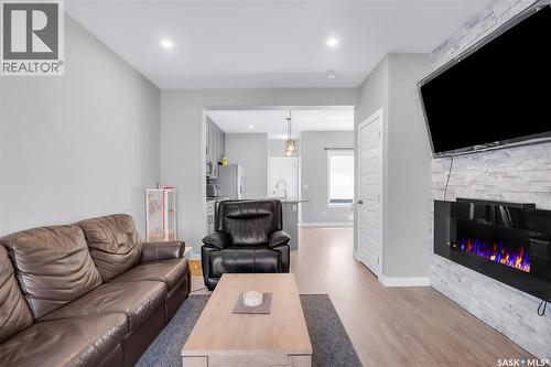 608 Brighton Gate, Saskatoon, SK - Indoor Photo Showing Living Room With Fireplace