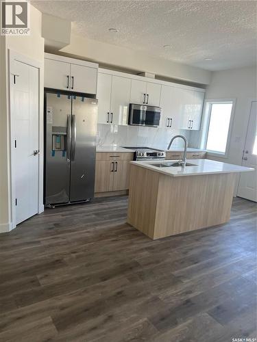 4513 Green Brooks Way E, Regina, SK - Indoor Photo Showing Kitchen With Double Sink