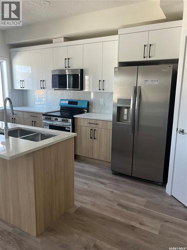 4513 Green Brooks Way E, Regina, SK - Indoor Photo Showing Kitchen With Double Sink With Upgraded Kitchen