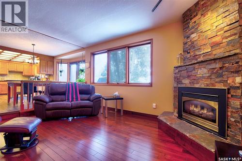 3623 Hanna Bay, Regina, SK - Indoor Photo Showing Living Room With Fireplace