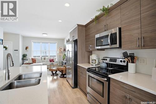 122 Greyeyes-Steele Way, Saskatoon, SK - Indoor Photo Showing Kitchen With Stainless Steel Kitchen With Double Sink With Upgraded Kitchen
