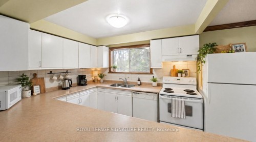 B-23 Connie Drive, Tiny, ON - Indoor Photo Showing Kitchen With Double Sink