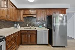 Kitchen with Quartz Countertops and S/S Appliances - 