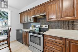Quartz Counters and Designer Backsplash in Kitchen - 