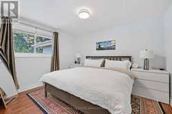 Primary Bedroom with Waterproof Laminate Flooring - 
