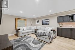 Large Recreation Room Equipped with a Custom Bar - 