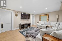 Large Recreation Room Equipped with a Custom Bar - 