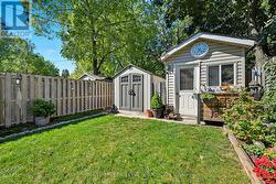 Includes Two Charming Garden Sheds - 