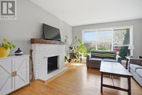 Main Floor: Living Room - 305 Stephen Street, London South (South B), ON - Indoor Photo Showing Living Room With Fireplace