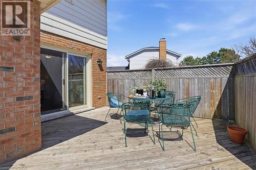 Wood-finish deck with privacy fencing and brick exterior - 113 Glenecho Court, Waterloo, ON - Outdoor With Deck Patio Veranda With Exterior