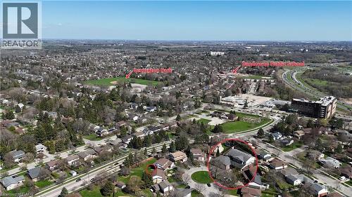 Aerial perspective of a residential neighborhood with a prominent public school and park within the vicinity - 113 Glenecho Court, Waterloo, ON - Outdoor With View