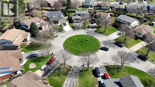 Aerial perspective showcasing a residential cul-de-sac with a central grassy island - 113 Glenecho Court, Waterloo, ON - Outdoor