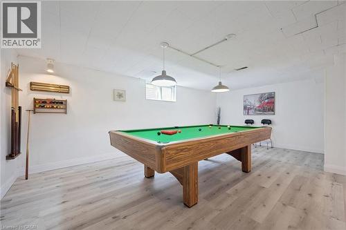 Recreation room featuring light wood-finish flooring, white walls, and a drop ceiling - 27 Silverspring Crescent, Kitchener, ON - Indoor Photo Showing Other Room