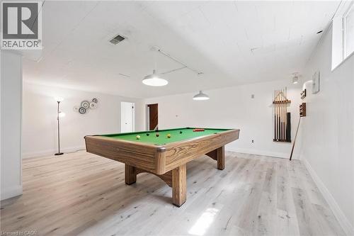 Recreation room featuring a pool table with green felt, pendant lighting, wood-finish flooring, and white walls - 27 Silverspring Crescent, Kitchener, ON - Indoor Photo Showing Other Room