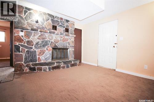 504 3Rd Avenue E, Frontier, SK - Indoor With Fireplace