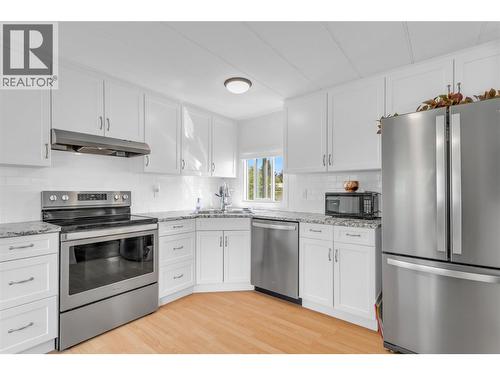Stainless appliances in the updated kitchen - 12022 Pretty Road Unit# 16, Lake Country, BC 