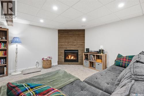 166 Magee Crescent, Regina, SK - Indoor Photo Showing Other Room With Fireplace