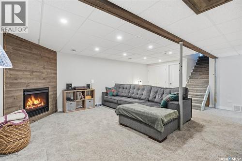 166 Magee Crescent, Regina, SK - Indoor Photo Showing Other Room With Fireplace