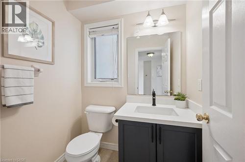 Half bath featuring vanity and toilet - 649 Doon South Drive, Kitchener, ON - Indoor Photo Showing Bathroom
