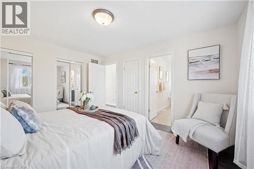 Bedroom featuring two closets and connected bathroom - 649 Doon South Drive, Kitchener, ON - Indoor Photo Showing Bedroom