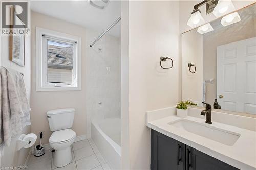 Bathroom with vanity, bathing tub / shower combination, and light tile patterned floors - 649 Doon South Drive, Kitchener, ON - Indoor Photo Showing Bathroom