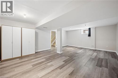 Below grade area featuring stairway and light wood finished floors - 649 Doon South Drive, Kitchener, ON - Indoor