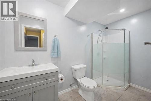 Full bathroom featuring vanity, a stall shower, and light tile patterned floors - 649 Doon South Drive, Kitchener, ON - Indoor Photo Showing Bathroom