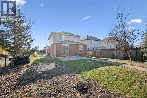 Back of house with brick siding, a fenced backyard, and a patio area - 649 Doon South Drive, Kitchener, ON - Outdoor