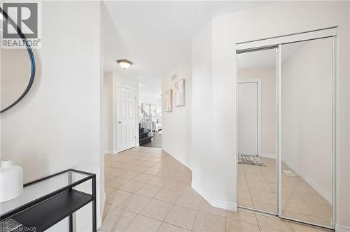 Corridor with light tile patterned flooring and baseboards - 649 Doon South Drive, Kitchener, ON - Indoor Photo Showing Other Room