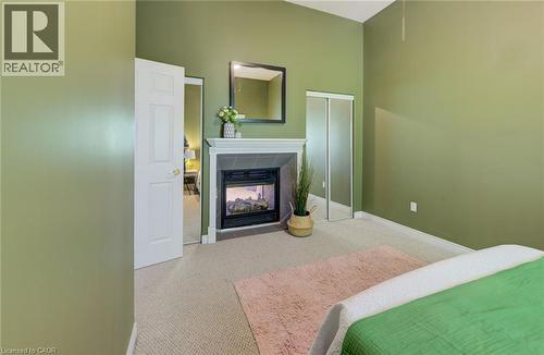 Upper unit - 2 Smetana Drive, Kitchener, ON - Indoor Photo Showing Bedroom With Fireplace