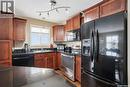 A206 103 Wellman Crescent, Saskatoon, SK  - Indoor Photo Showing Kitchen With Double Sink 