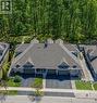 Townhome exterior with a dark gray shingle roof and light gray siding - 227 Chestnut Hill Crescent, Kitchener, ON  - Outdoor 