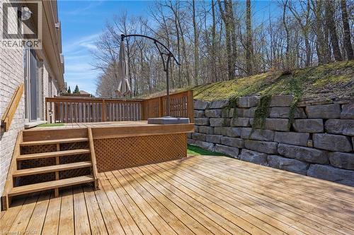 Multi-level wood deck featuring lattice skirting, a built-in hot tub, and wood railings - 227 Chestnut Hill Crescent, Kitchener, ON - Outdoor With Deck Patio Veranda With Exterior