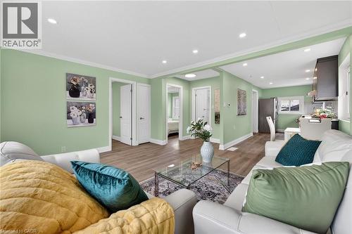 Open-concept living area with recessed lighting and crown molding - 36 Mahony Avenue, Hamilton, ON - Indoor